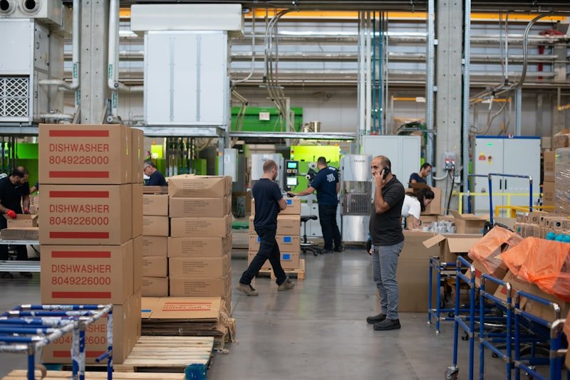 Warehouse team member beside packed cargo